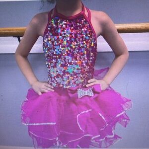 Hot pink sparkly tutu with matching hair, bow sizes.